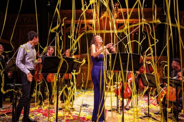 Nicola Benedetti stands in the middle of the stage smiling with streamers reigning down upon her.,© Andrew Perry
