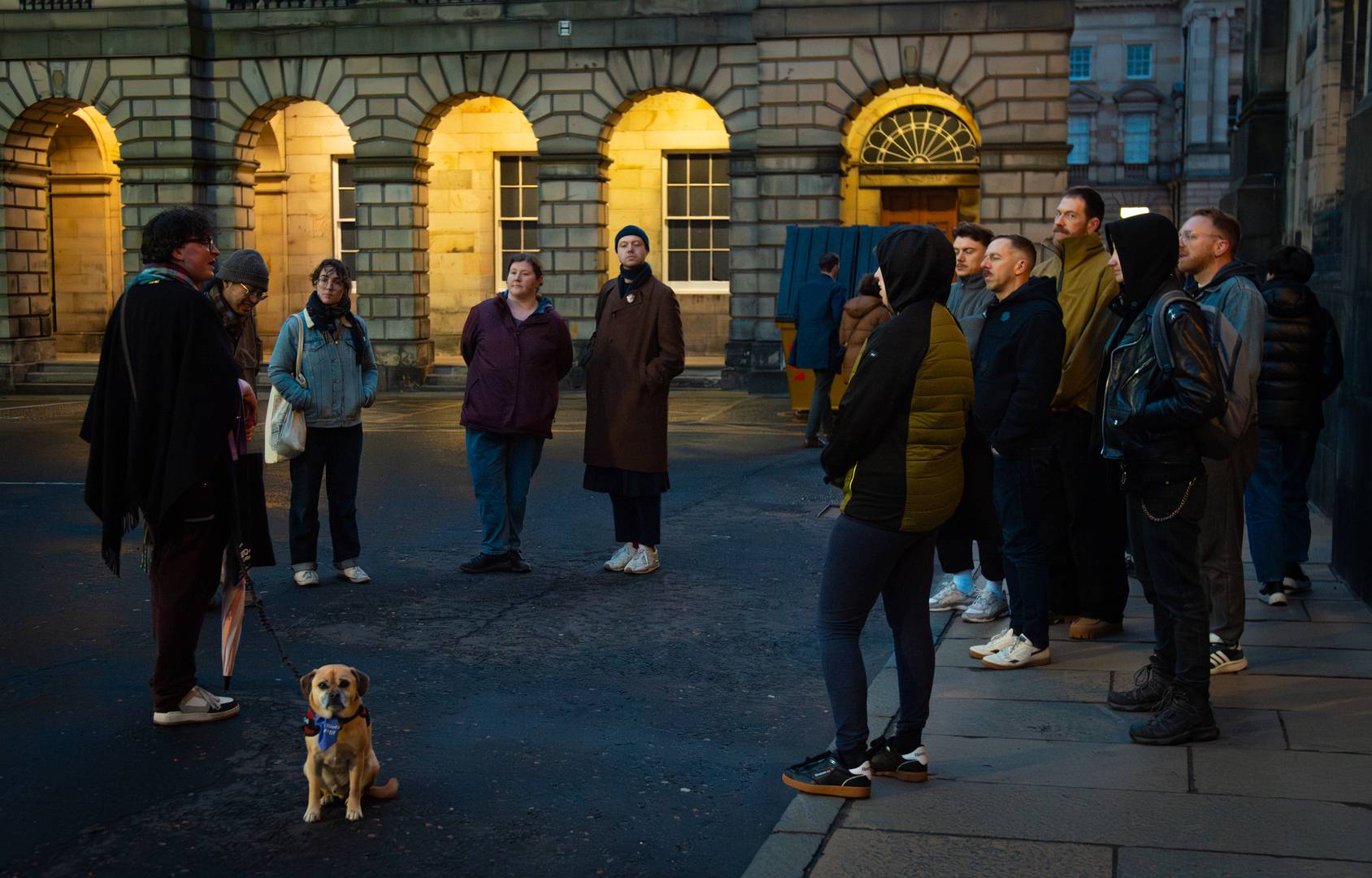 The tour guide talking to a medium sized group