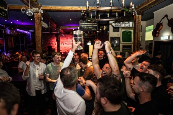 Sports team lift a trophy in a pub,© Malones Edinburgh