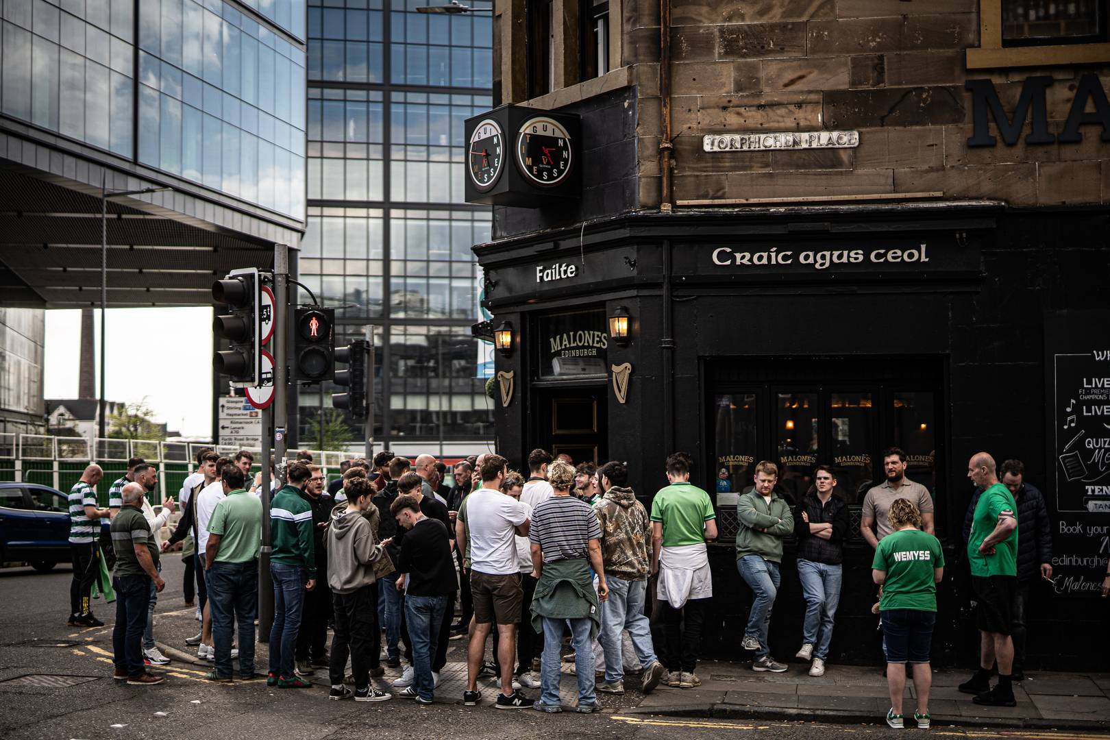 Crowd gathers outside a pub,© Malones Edinburgh