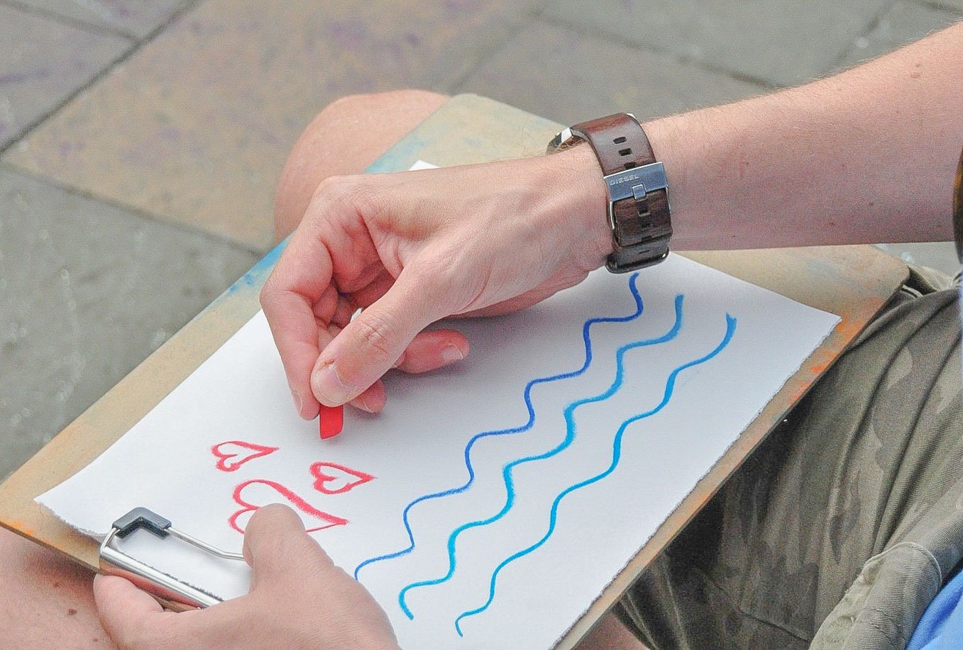 A close up of someone drawing a picture