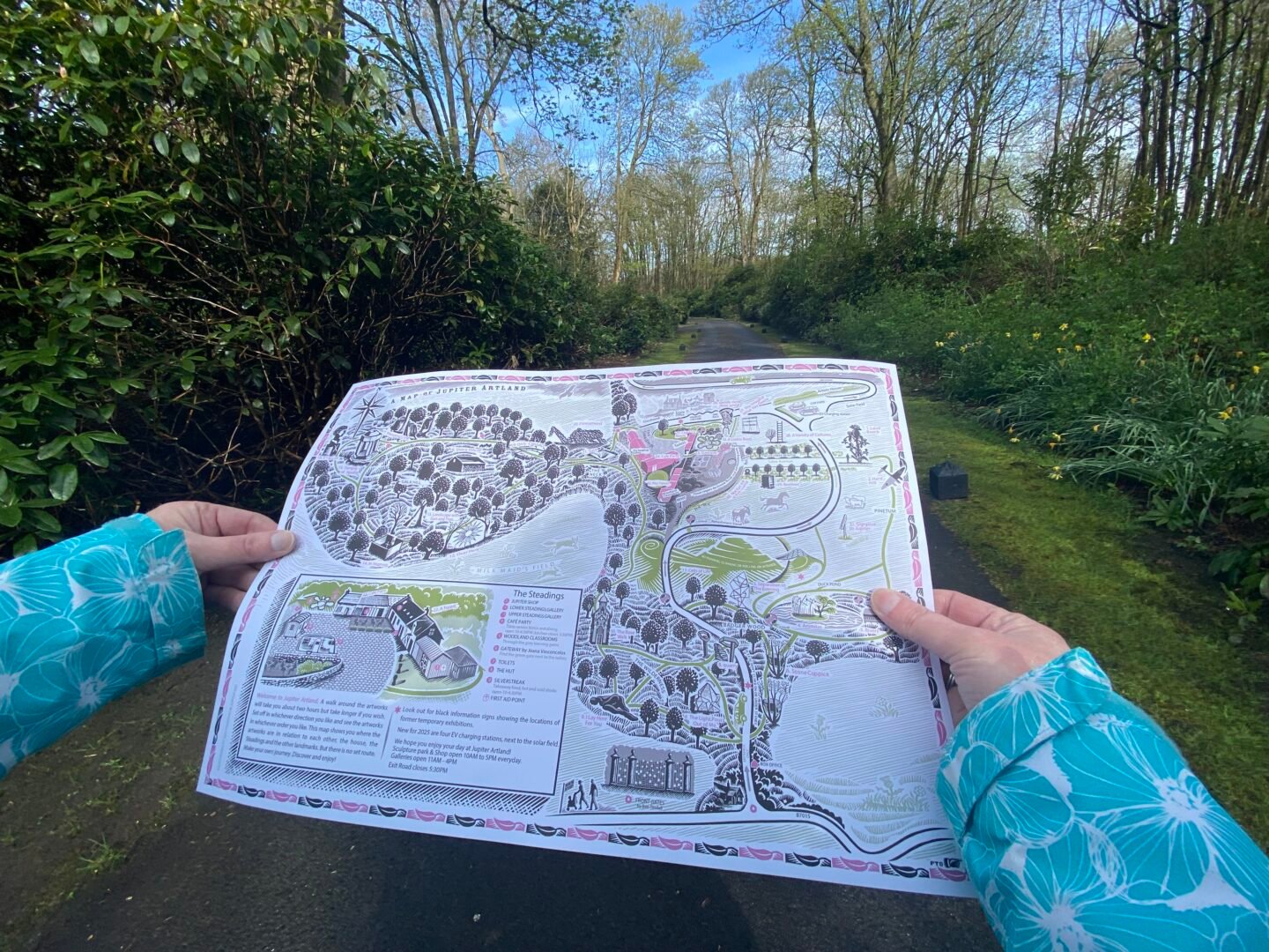 Hands holding site map at Jupiter Artland