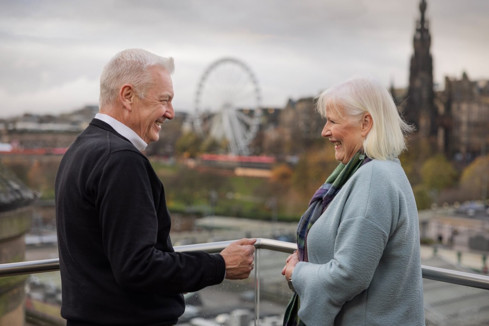 Older Couple on balcony of Nor Loft