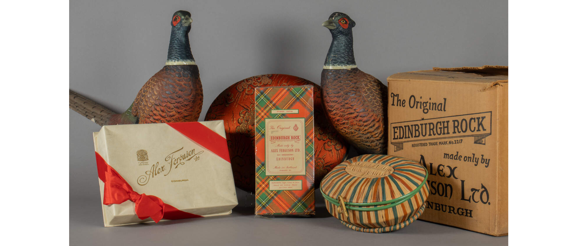 Two ornamental grouse and a selection of boxes of Alex Ferguson Edinburgh rock
