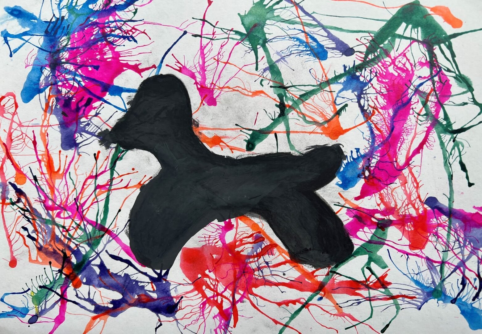 Abstract image of a black silhouetted dog on a paint splattered background.