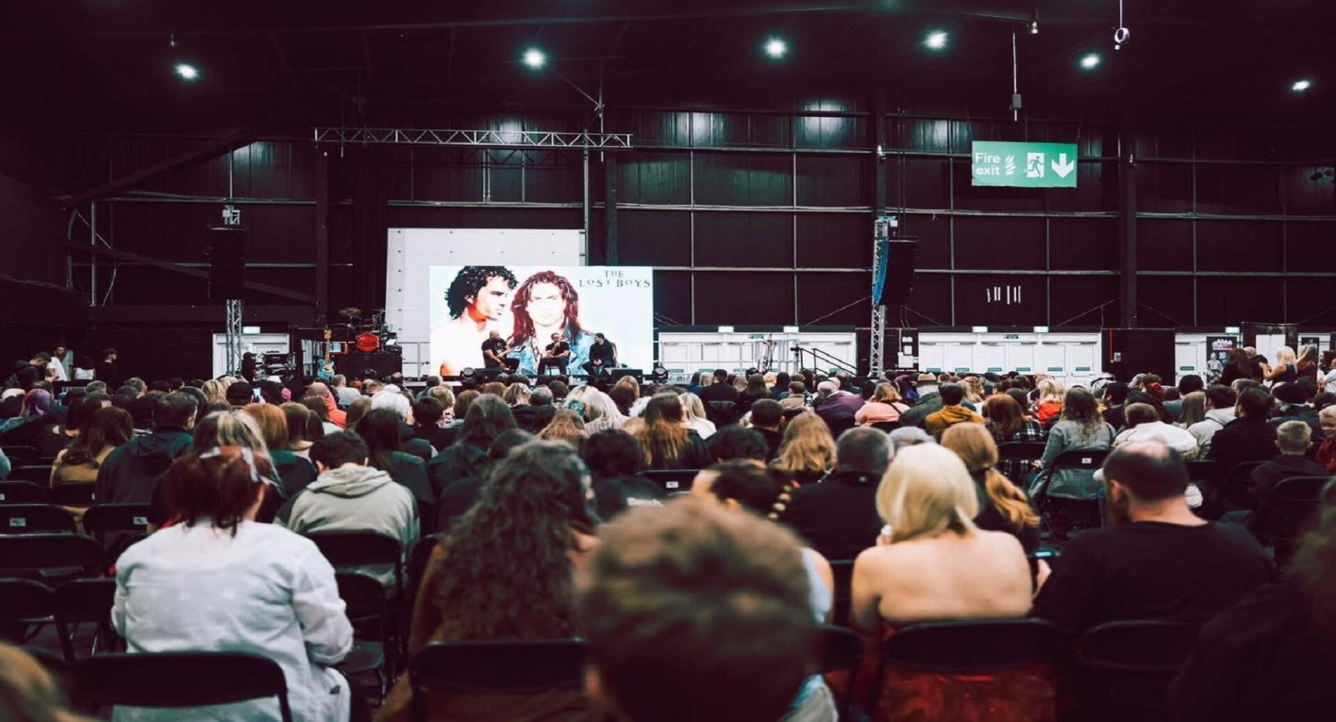 A large group watching an event at Comic Con