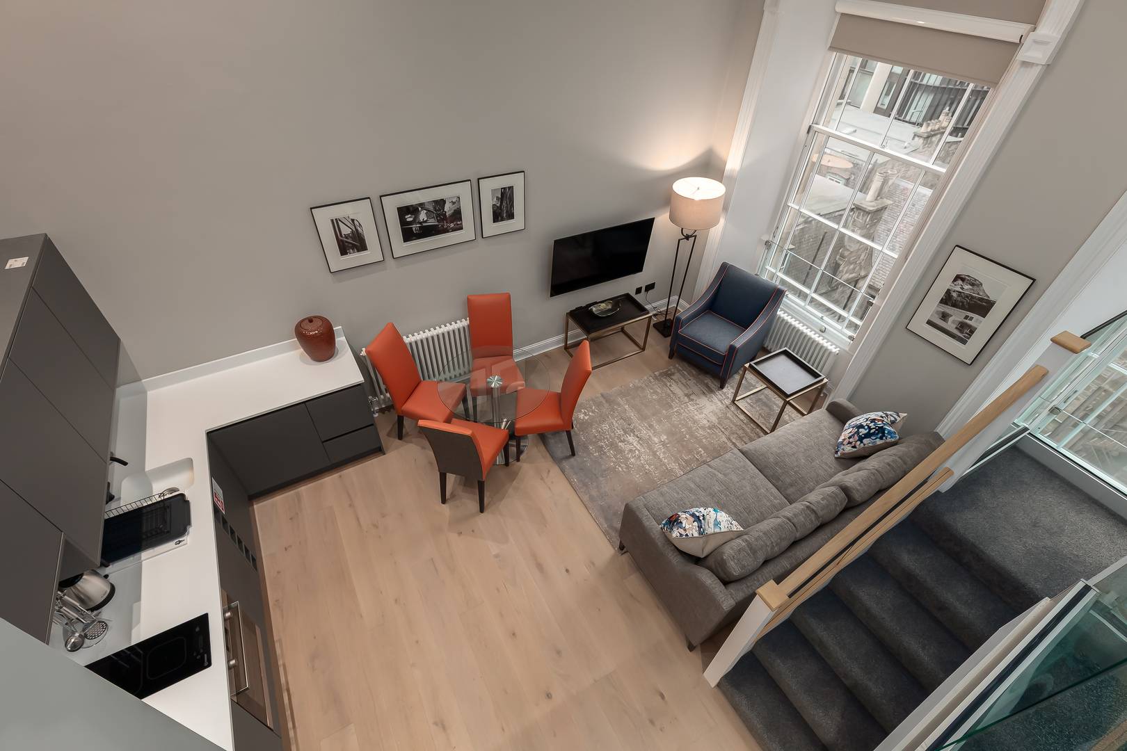 Destiny Scotland Apartments looking down on sitting room / kitchen from upstairs.,© Destiny Scotland