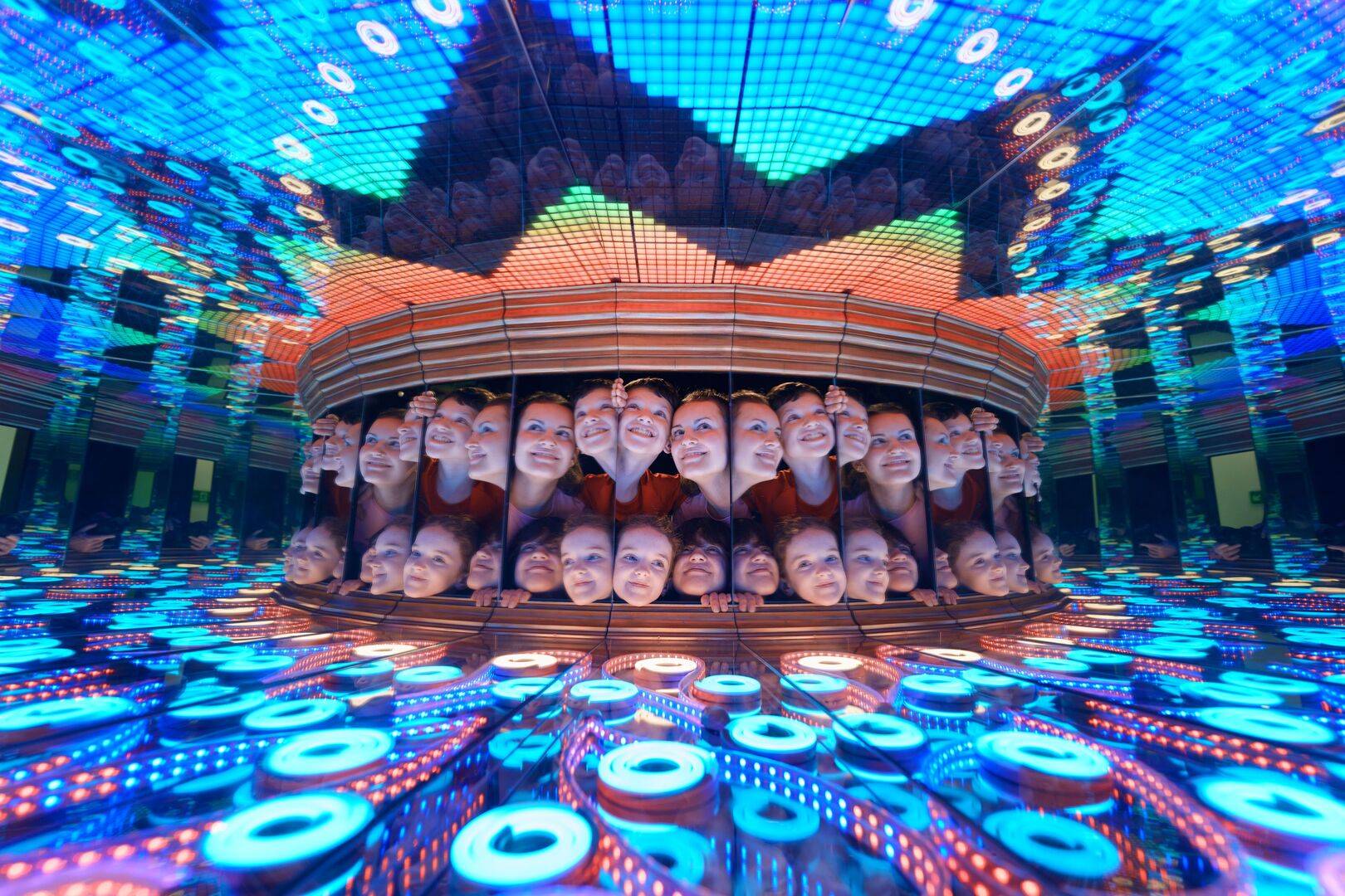 Children with their faces in a mirrored box with blue lighting. The Perpetual Portrait exhibit at Camera Obscura & World of Illusions,© Camera Obscura & World of Illusions, Edinburgh