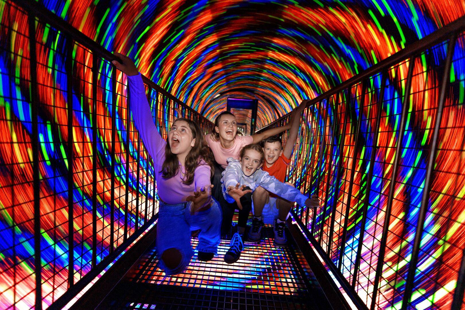 Children in a swirling tunnel of coloured lights. The Vortex Tunnel at Camera Obscura & World of Illusions, Edinburgh.,© Camera Obscura & World of Illusions, Edinburgh