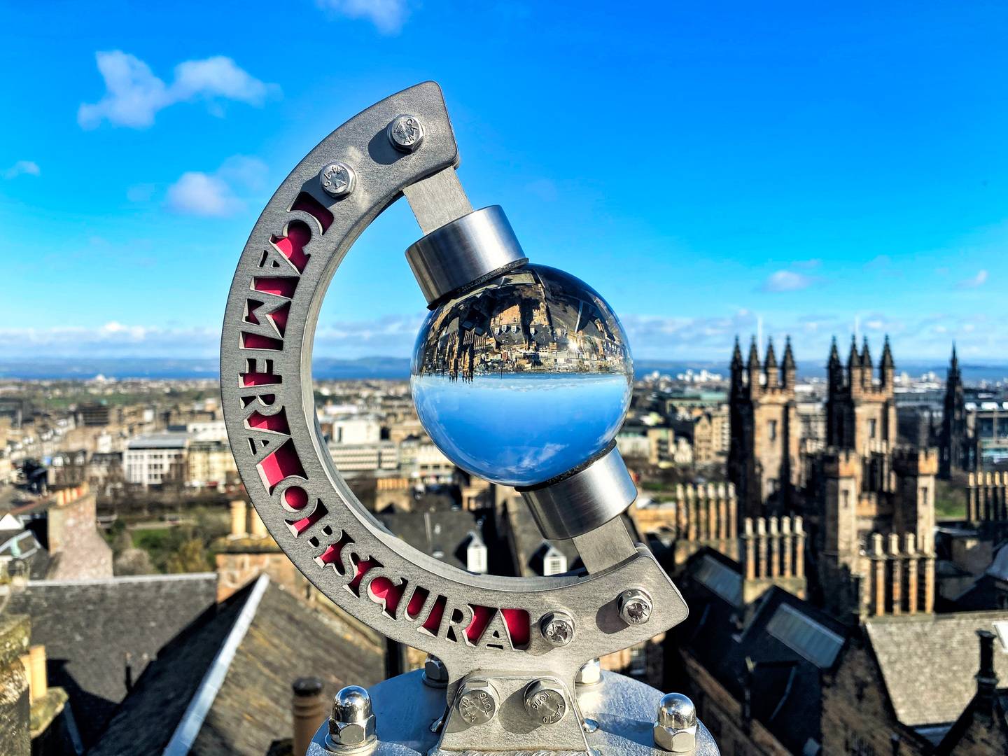 A glass ball on a rooftop reflects the view upside down. The Globe at Camera Obscura & World of Illusions, Edinburgh,© Camera Obscura & World of Illusions, Edinburgh