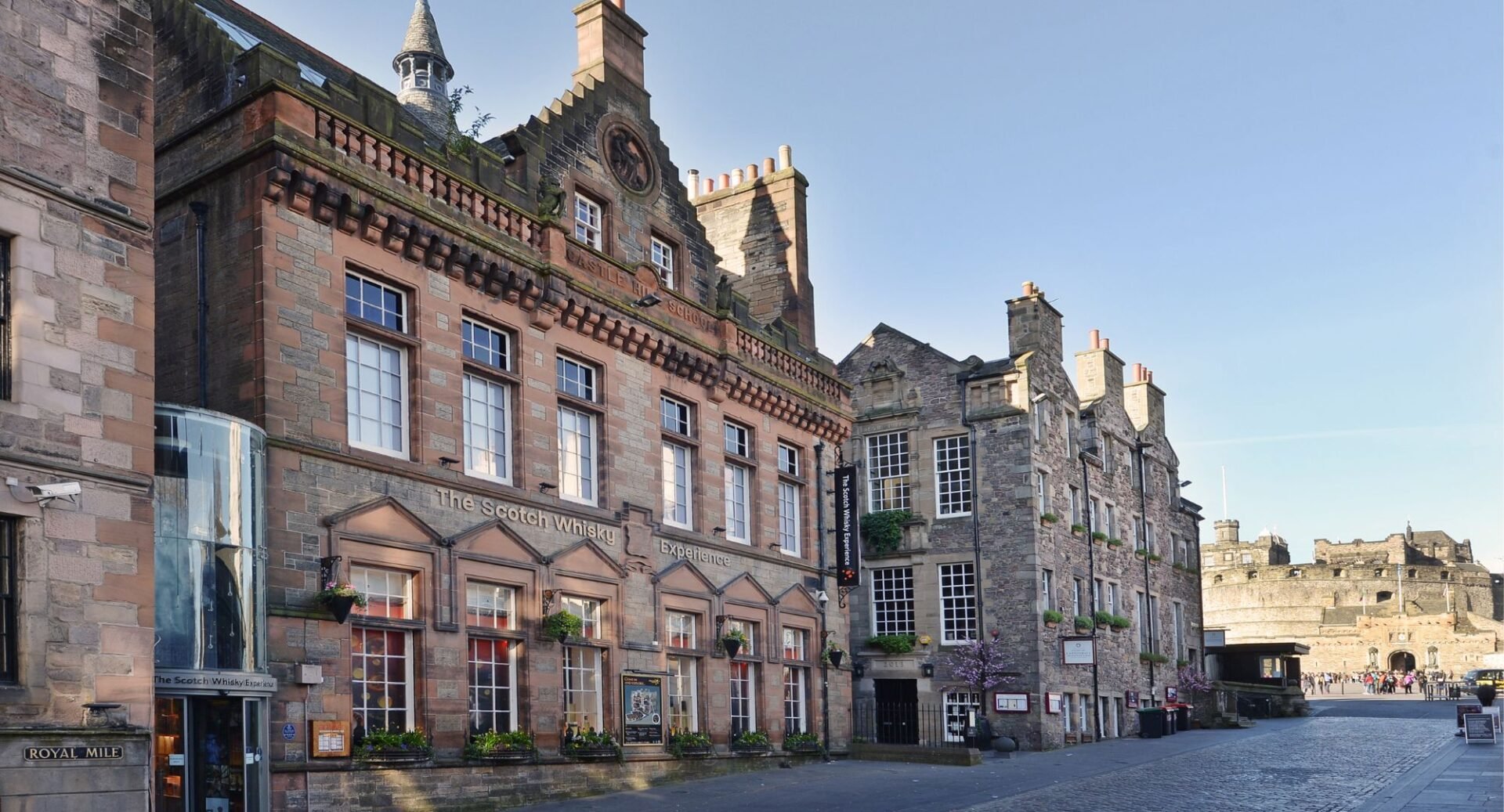 An exterior shot of the Scotch Whisky Experience building with the Castle in the background