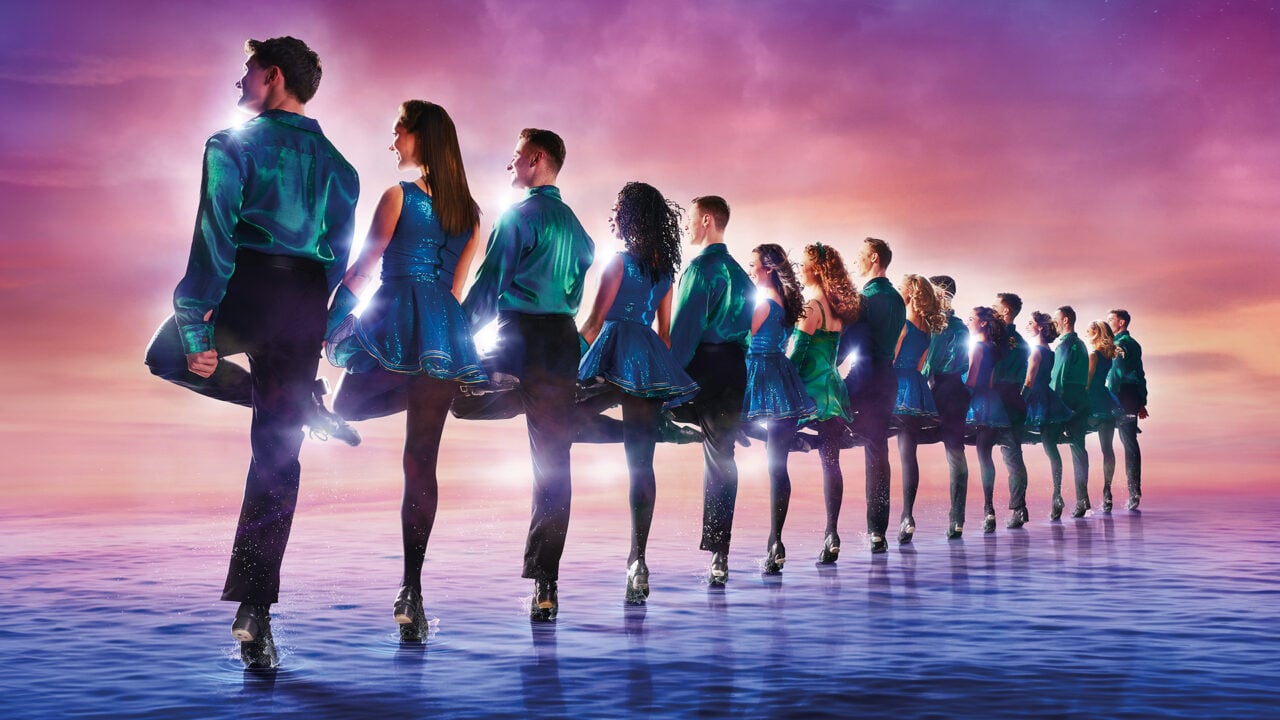 A line of people dancing, against a pink and purple background.