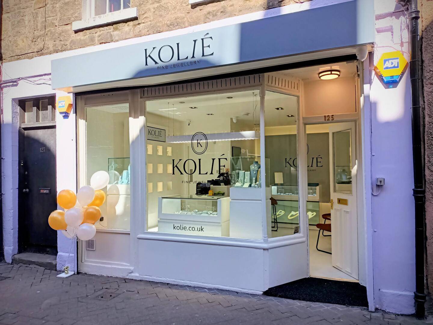 Kolié Fine Jewellery Edinburgh boutique storefront at 125 Rose Street, displaying solid gold jewellery in the windows.,© Kolié Fine Jewellery