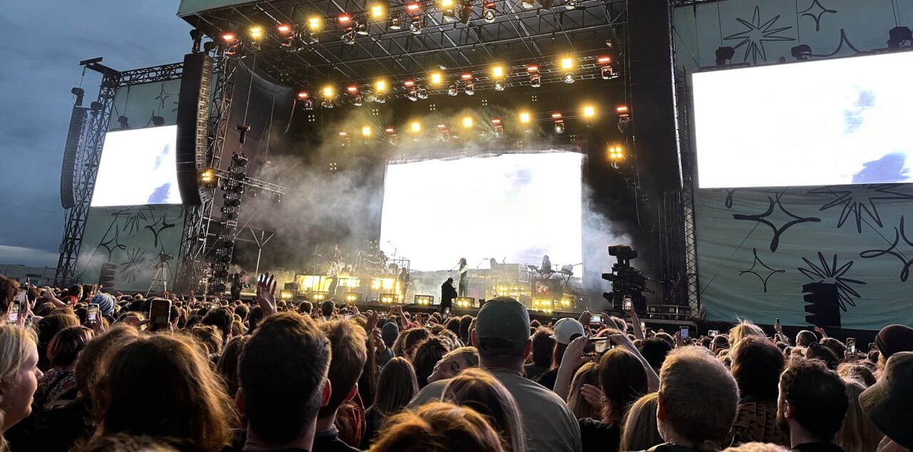 Connect festival crowd looking to performer on stage at night