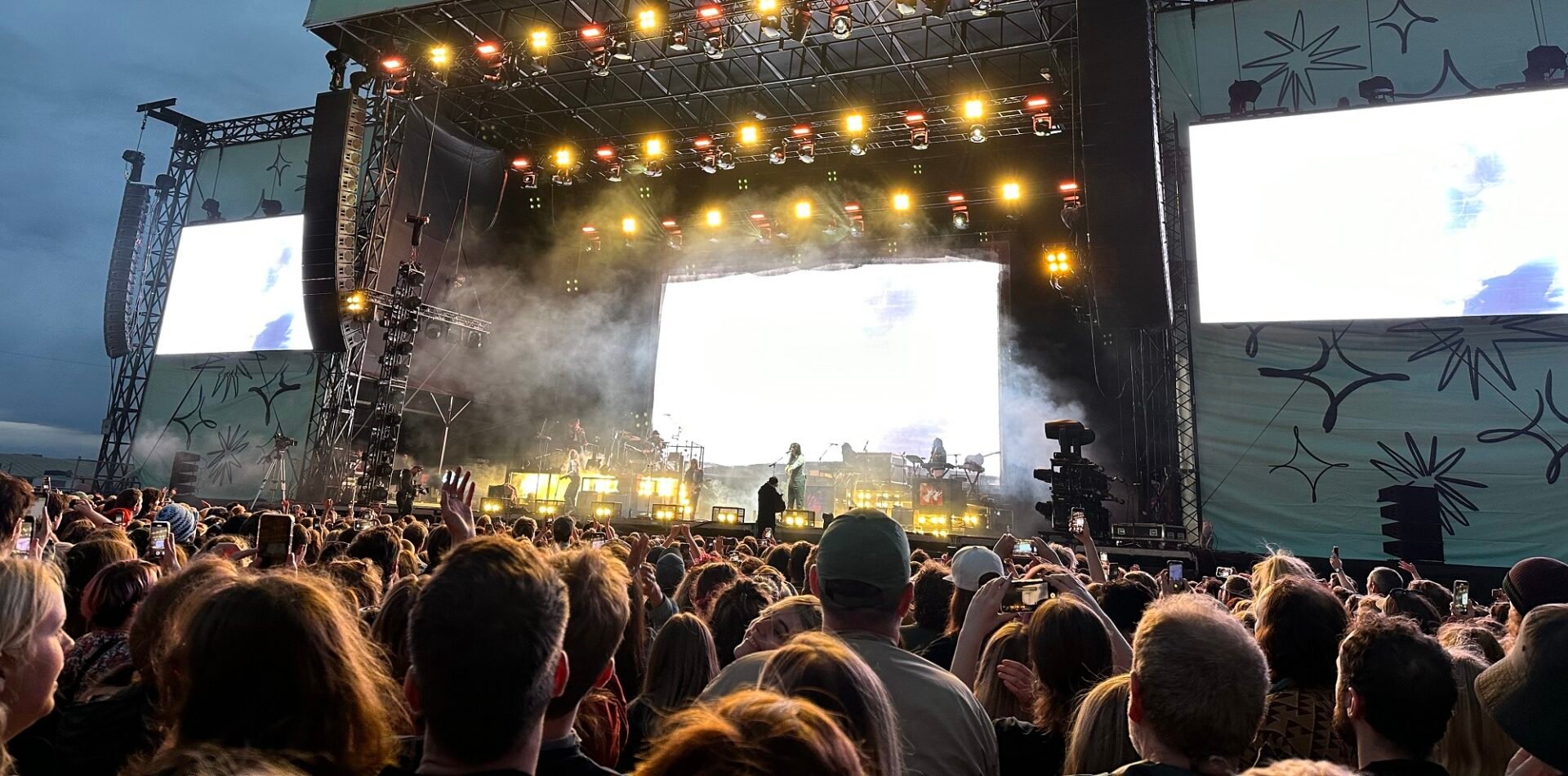 Connect festival crowd looking to performer on stage at night