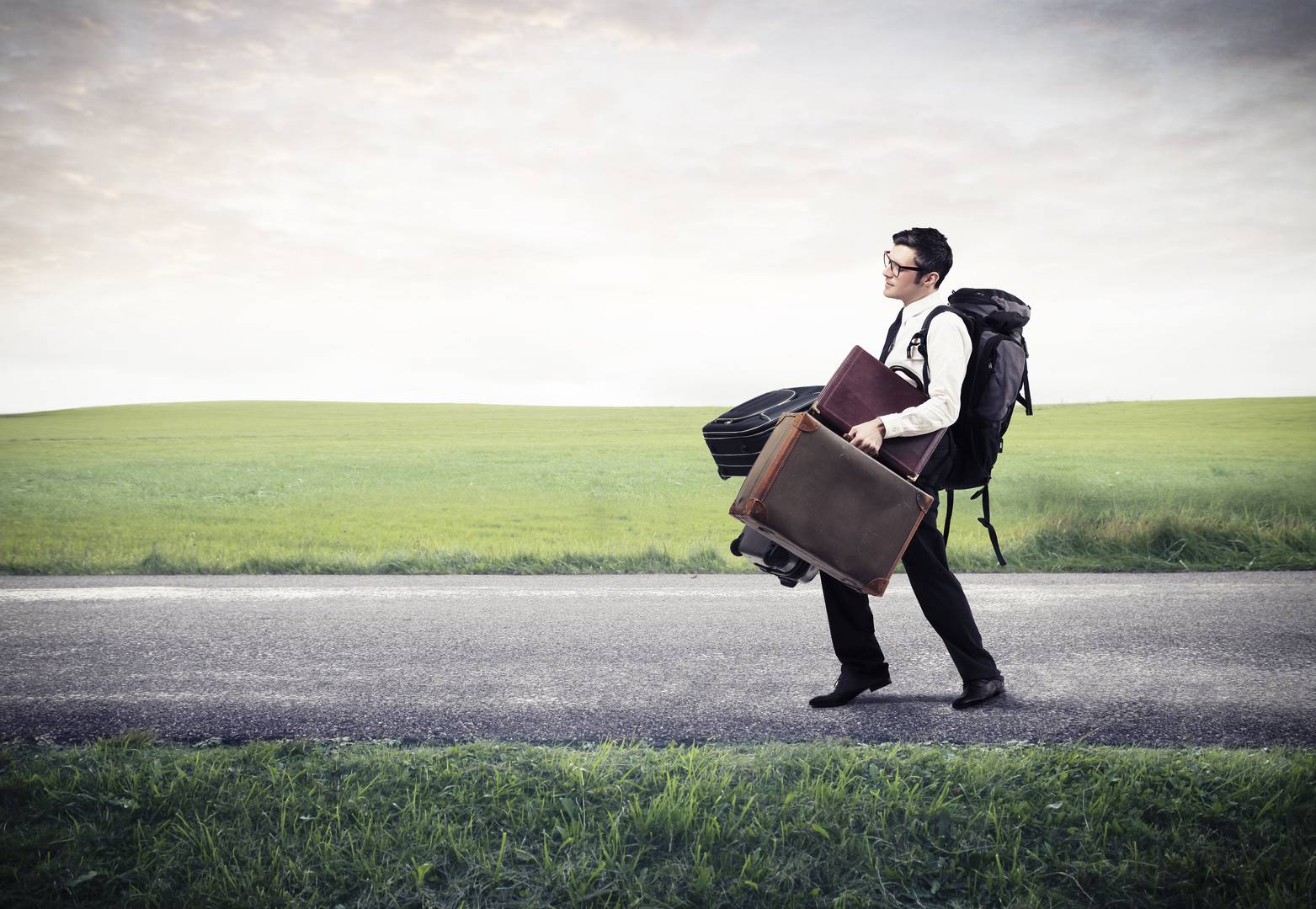 man walking with lots of luggage AiroLuggage