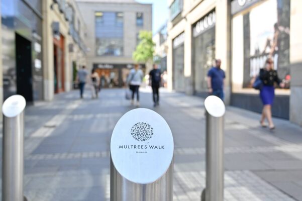Multrees Walk walkway with Multrees Walk  logo embossed on metal bollard,© Multrees Walk