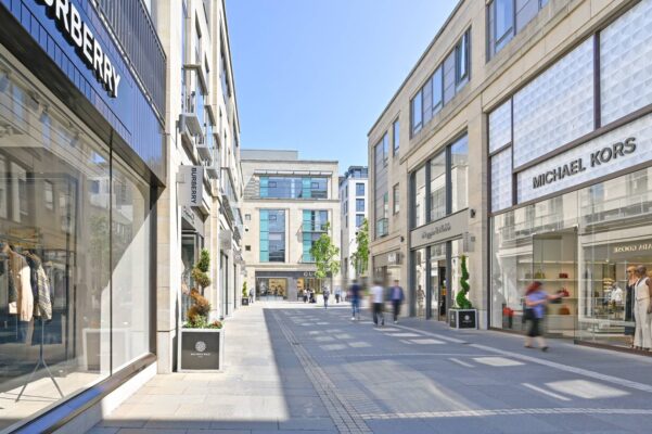 Multrees Walk street lined with brands including Burberry, Michael Kors and Mappin & Webb,© Multrees Walk