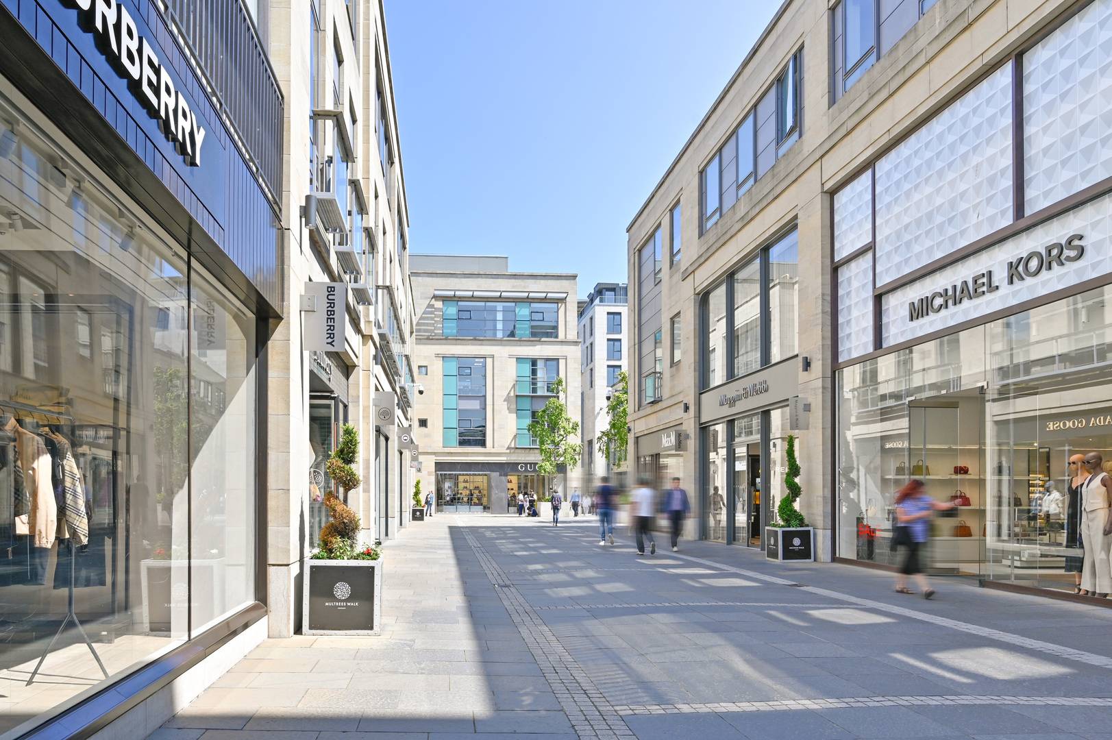 Multrees Walk street lined with brands including Burberry, Michael Kors and Mappin & Webb,© Multrees Walk