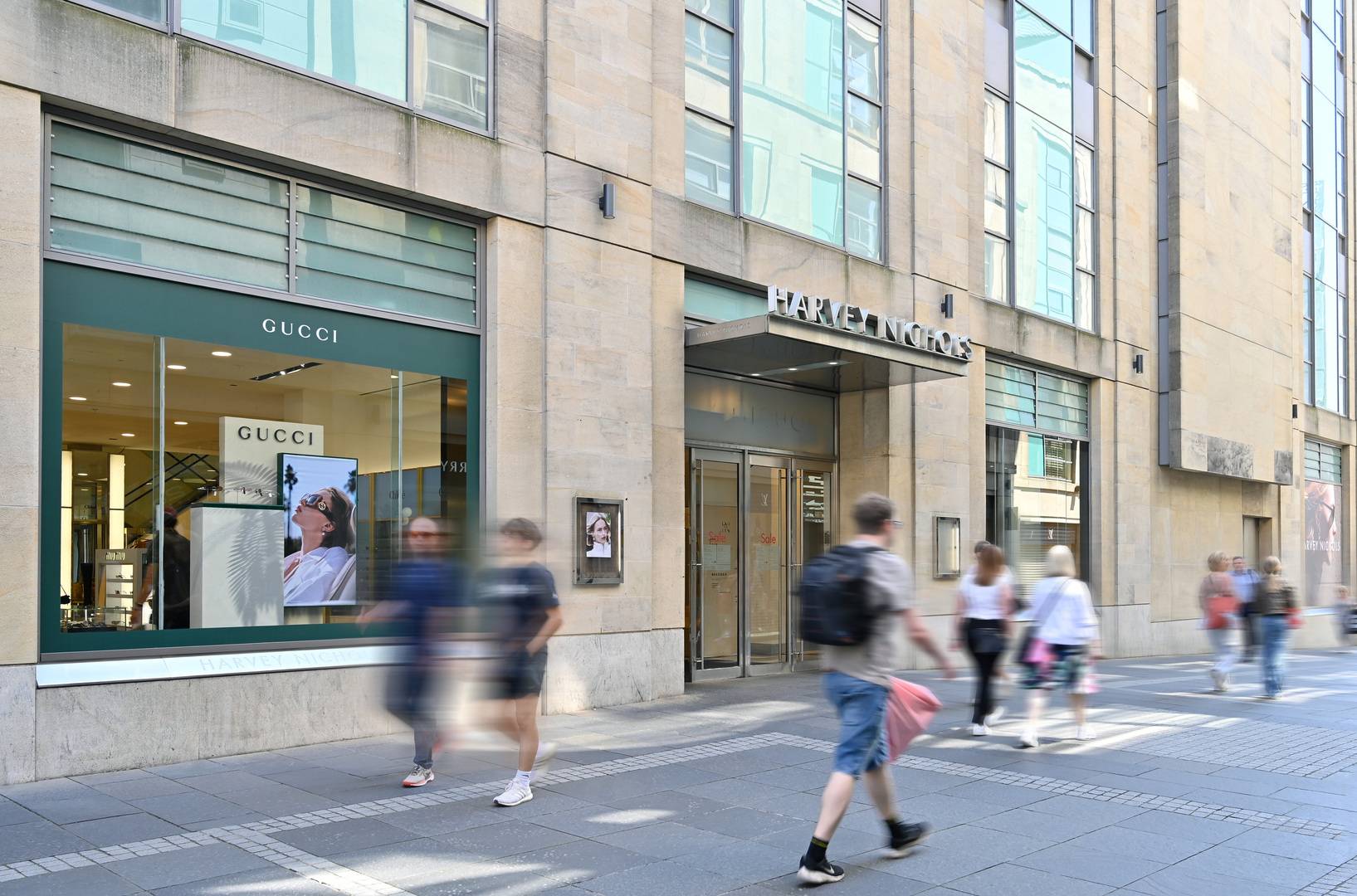 Harvey Nichols store entrance and window with Gucci display at Multrees Walk,© Multrees Walk