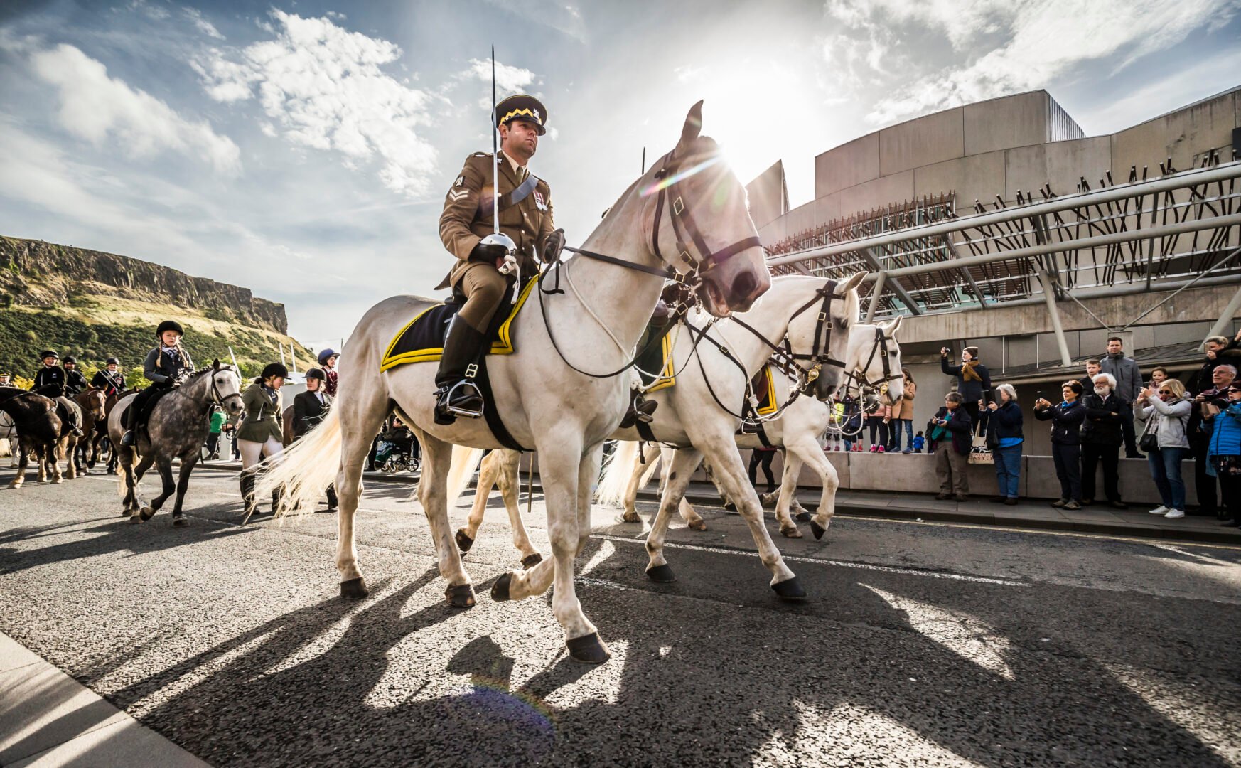 Royal Scots Dragoon Guards pn horseback at the 2018 event, with the Parliament and Arthur's Seat in the background