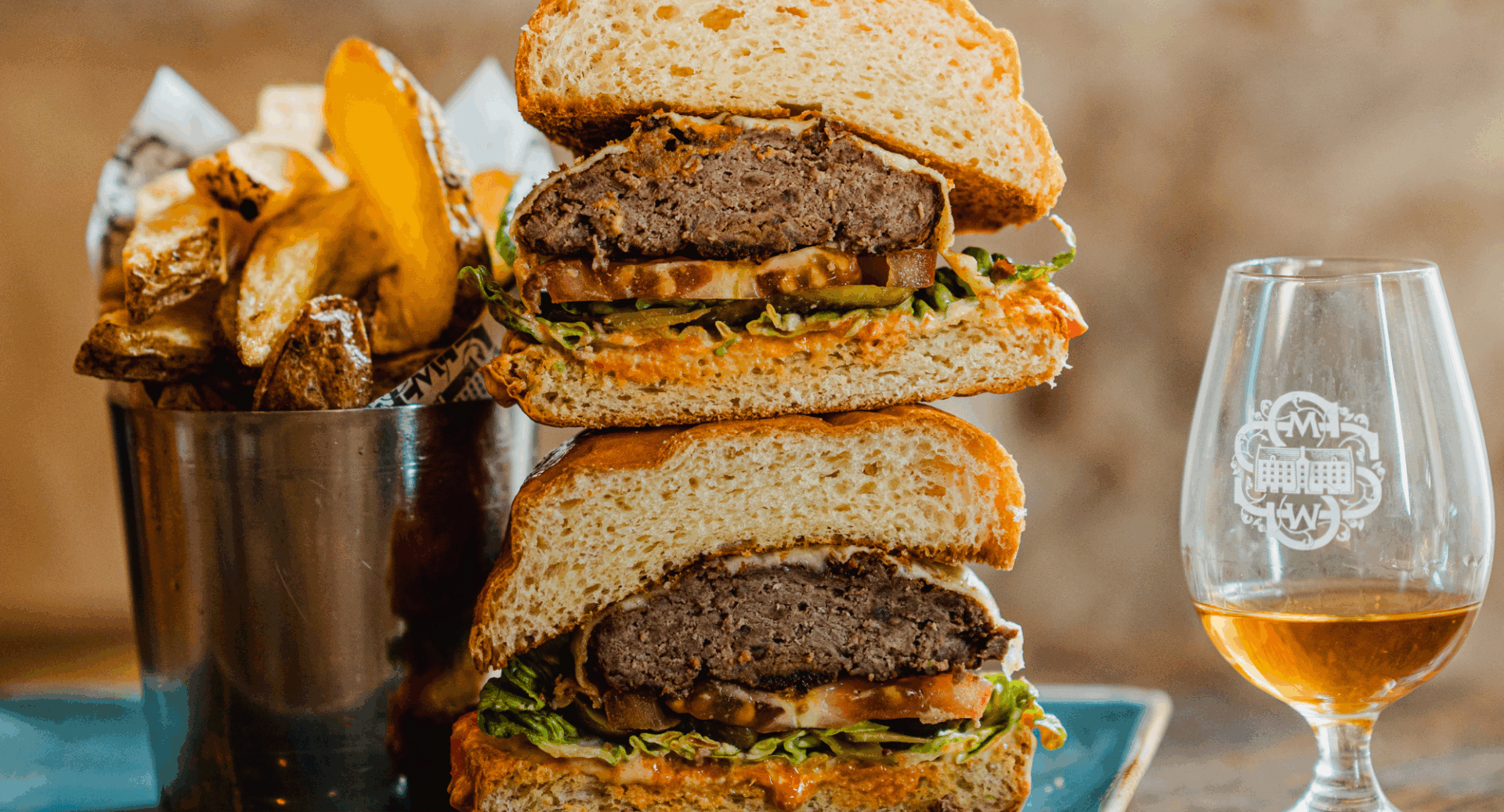 Close up of a cheeseburger and chips