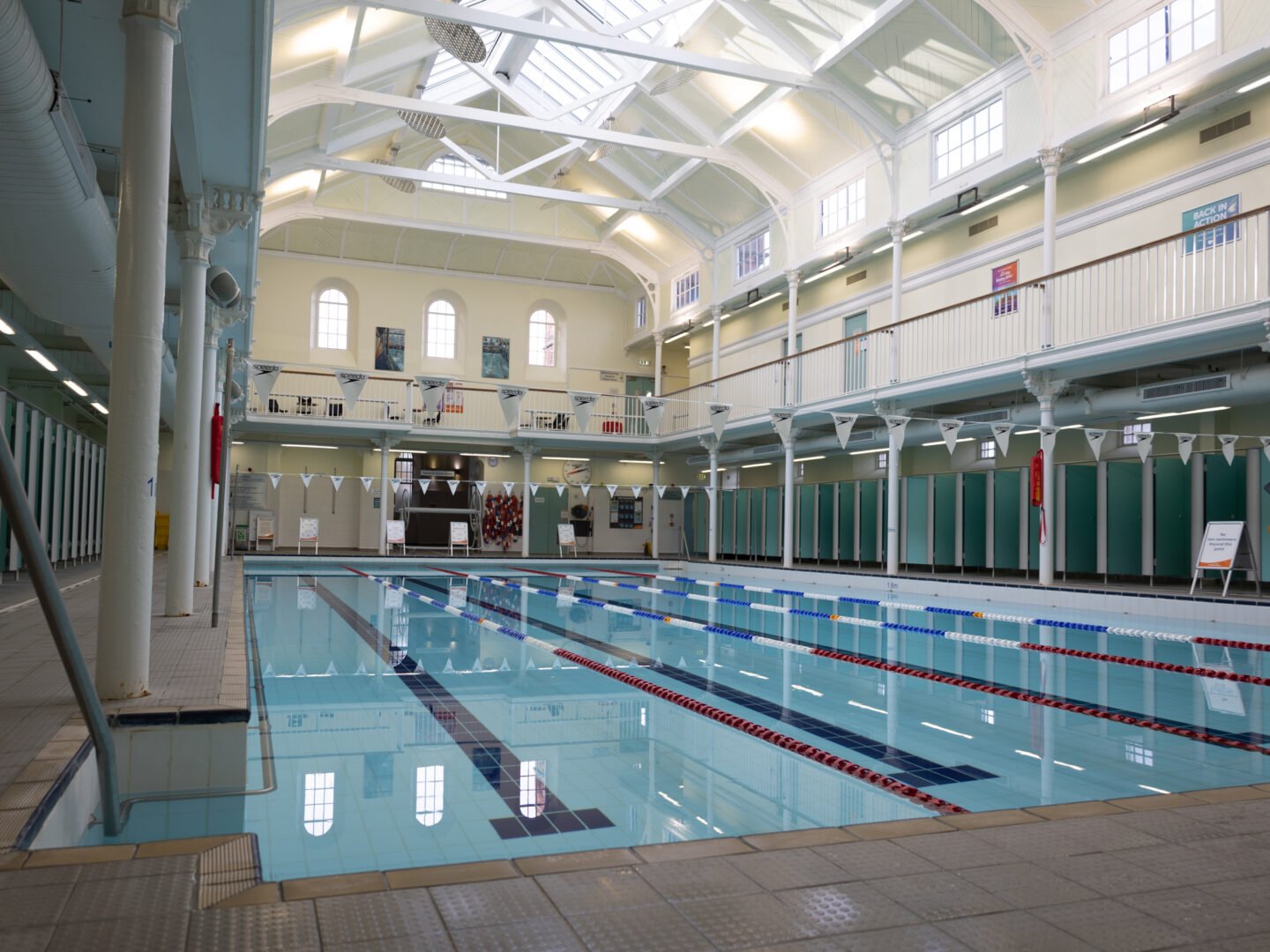 The pool at Glenogle Swim Centre, with a balcony above and changing rooms off.