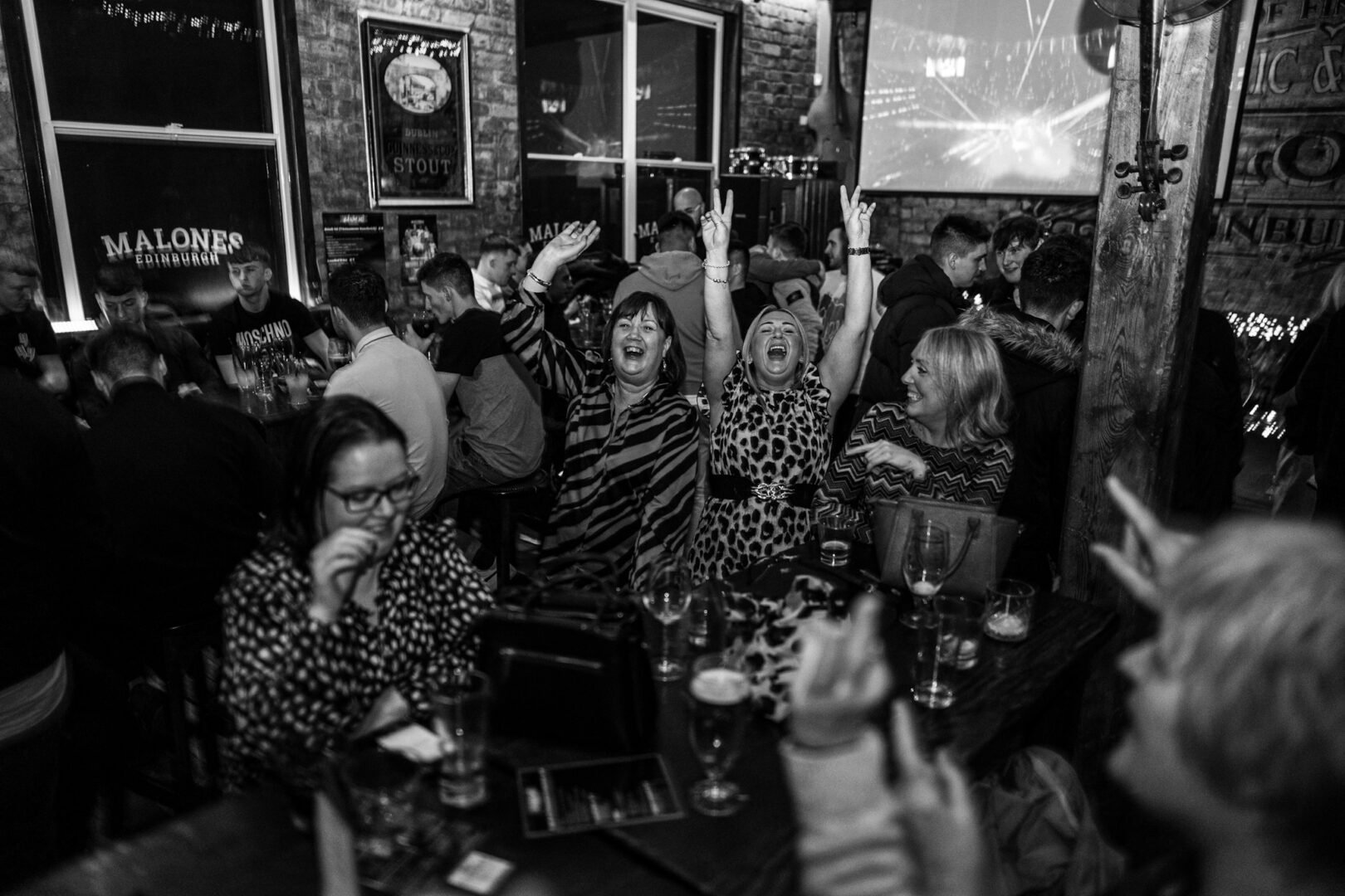 Black and white photo of a crowd dancing in Malones Edinburgh