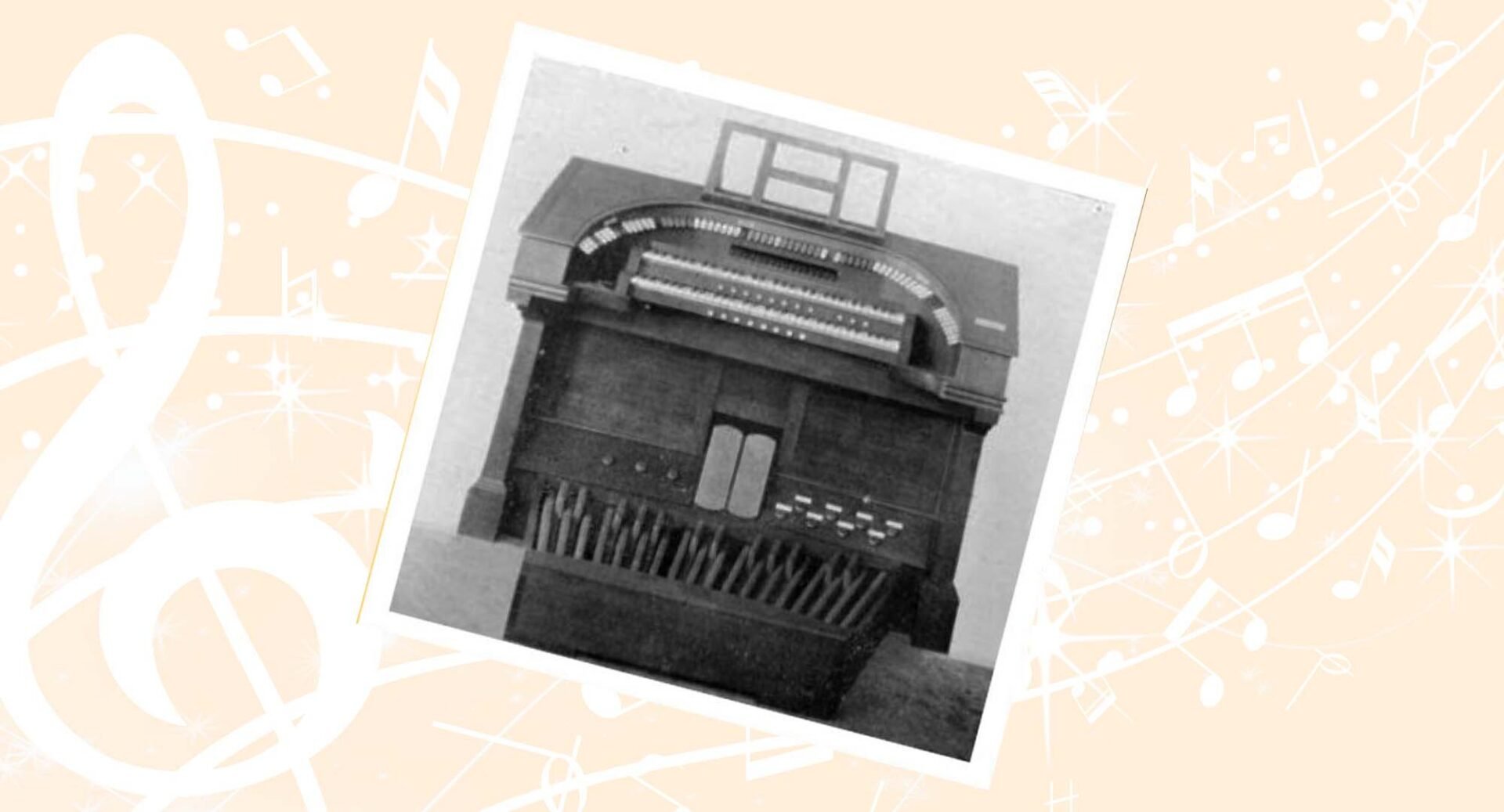 Black and white photo of a musical organ.