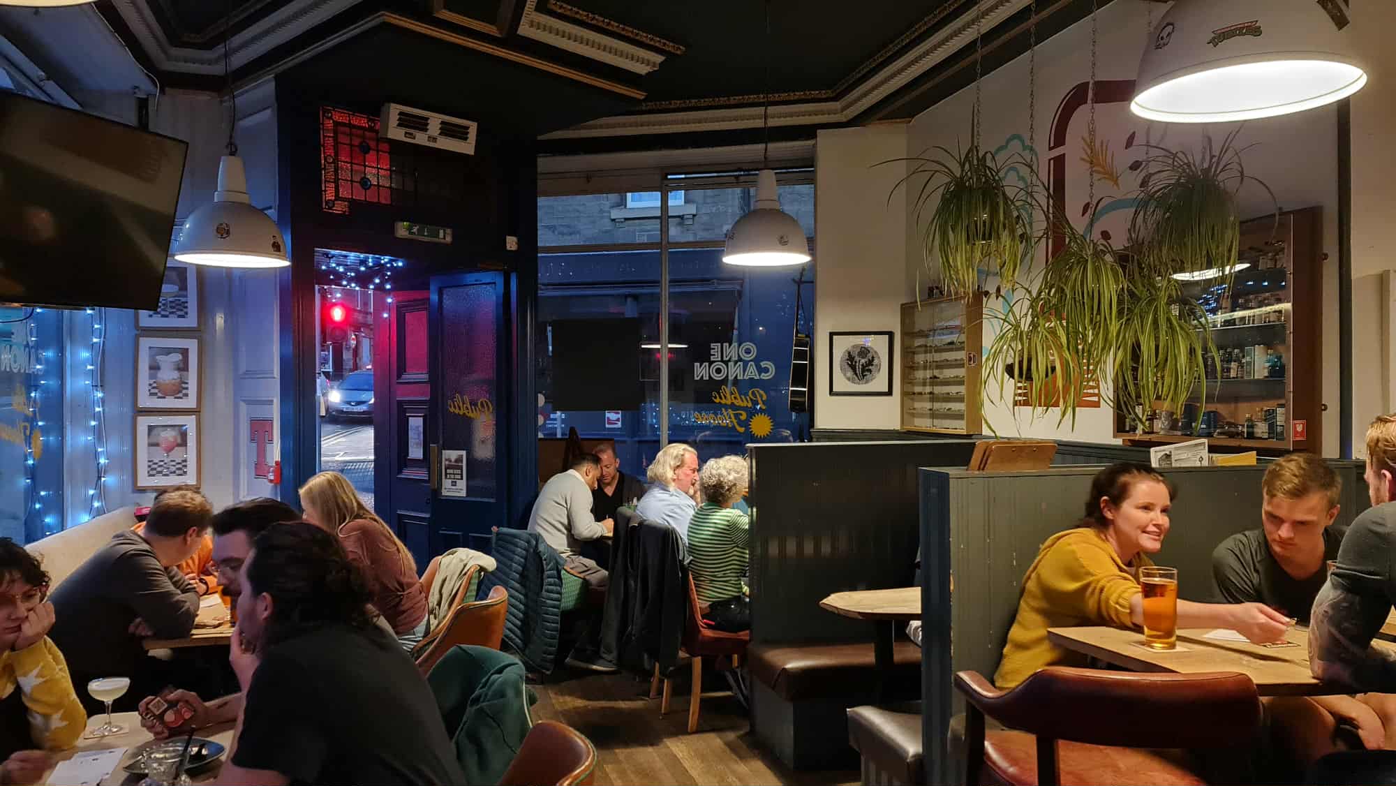 People in booths at One Canon