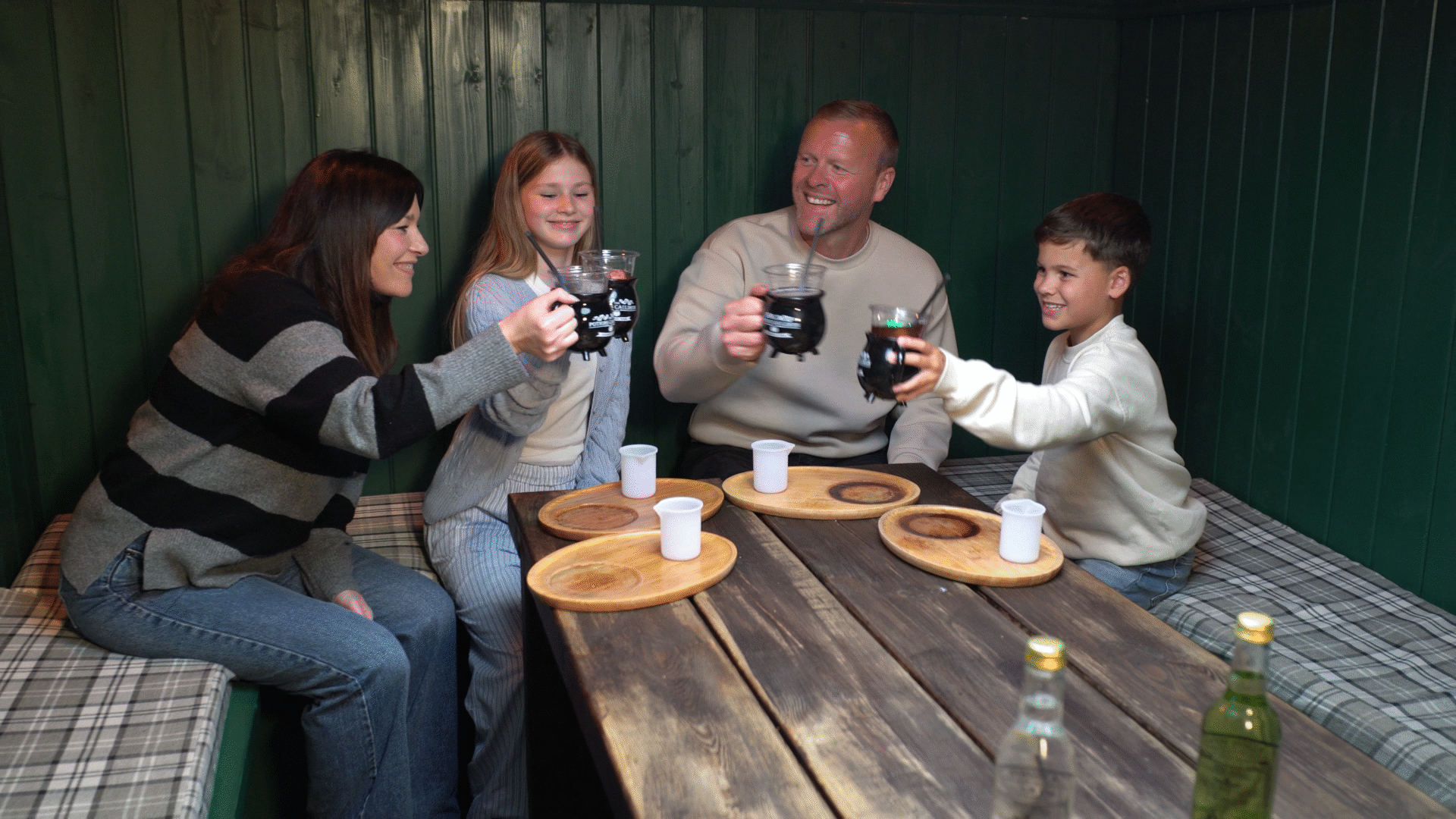 family cheers at Potions Cauldron