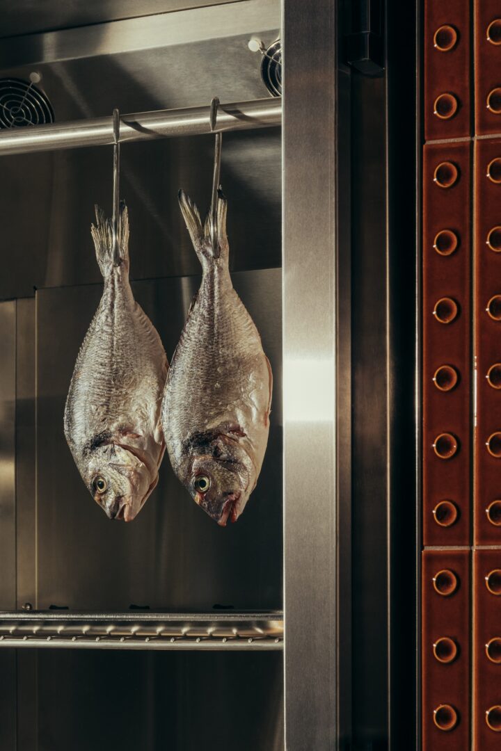Fish hanging in Lyla restaurant kitchen