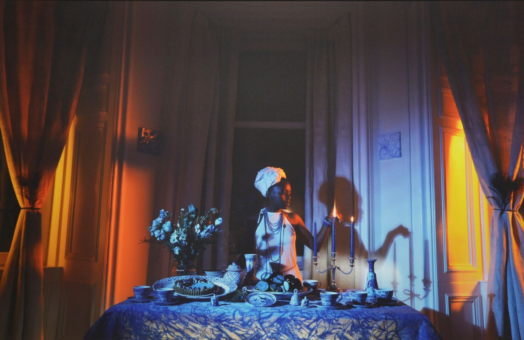 Image of a woman lighting a candle
