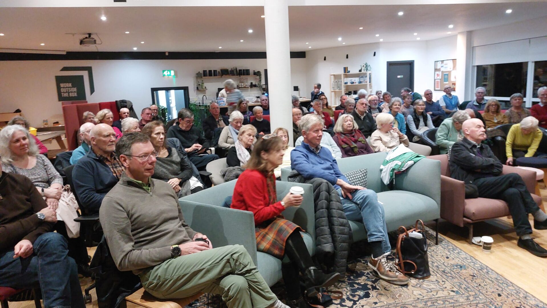 An audience sitting down