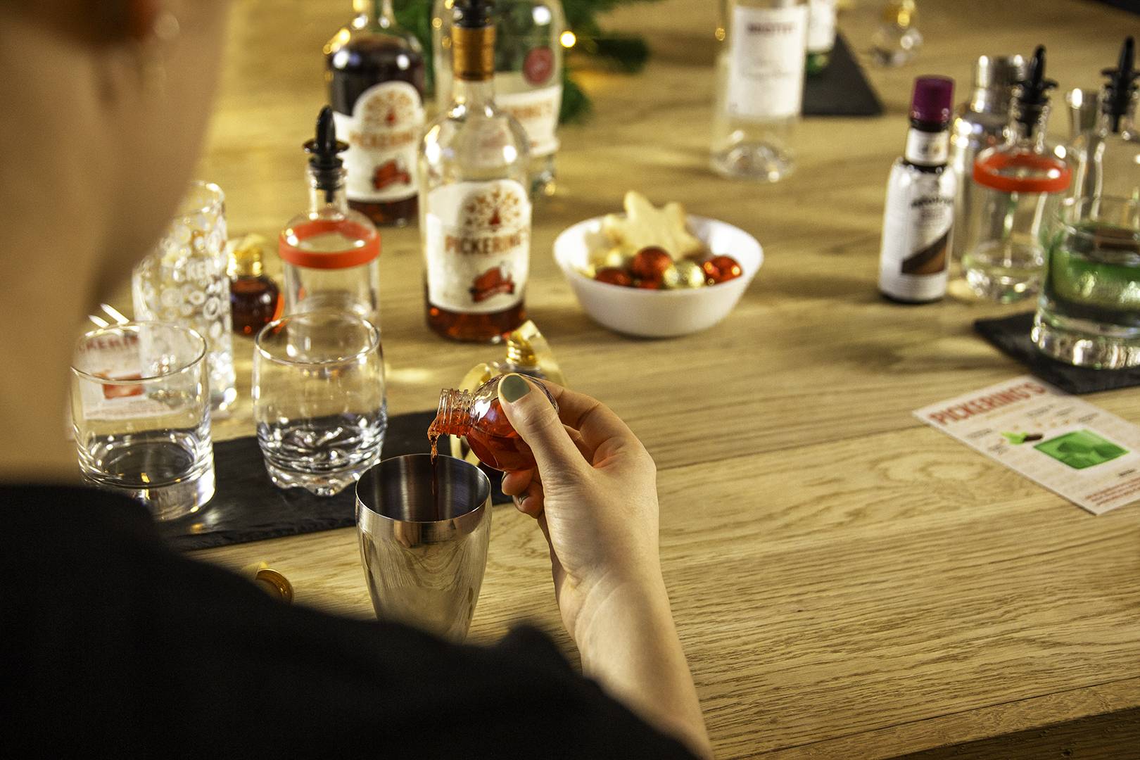 contents of Pickerings Gin bauble being added to cocktail shaker