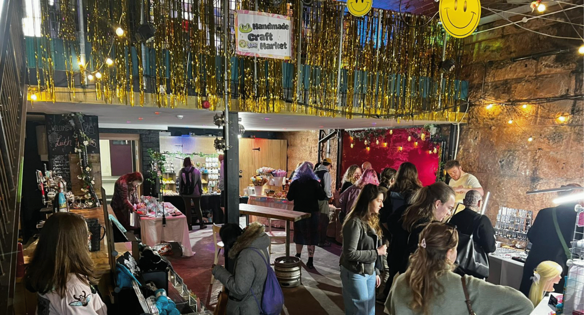 People chatting and sitting down in a decorated room