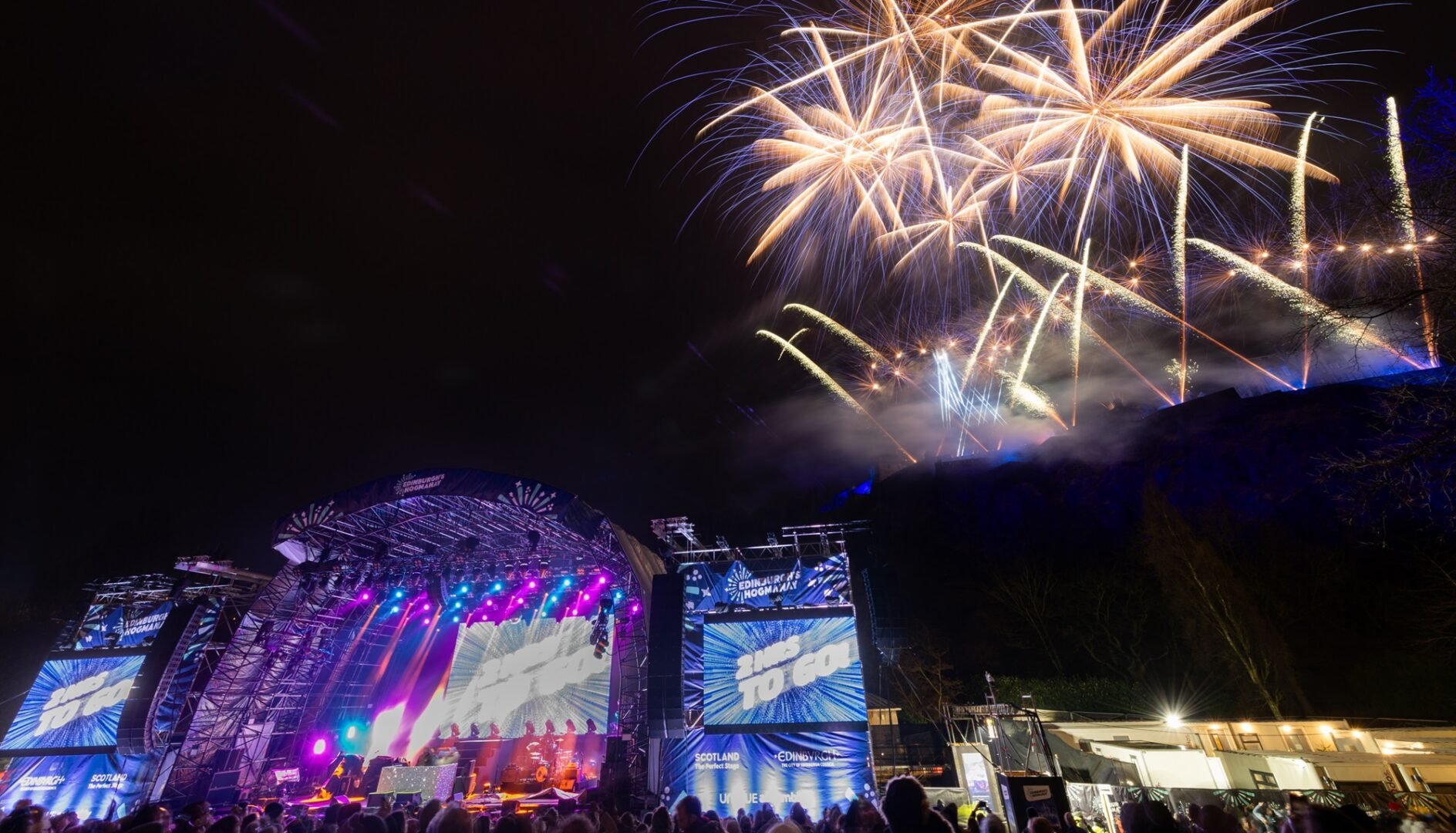 Hogmanay Fireworks over Edinburgh Castle with Ross Bandstand in front of image