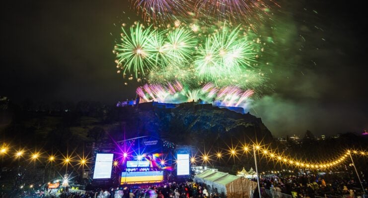 Fireworks over castle and behind Ross Bandstand during Hogmanay