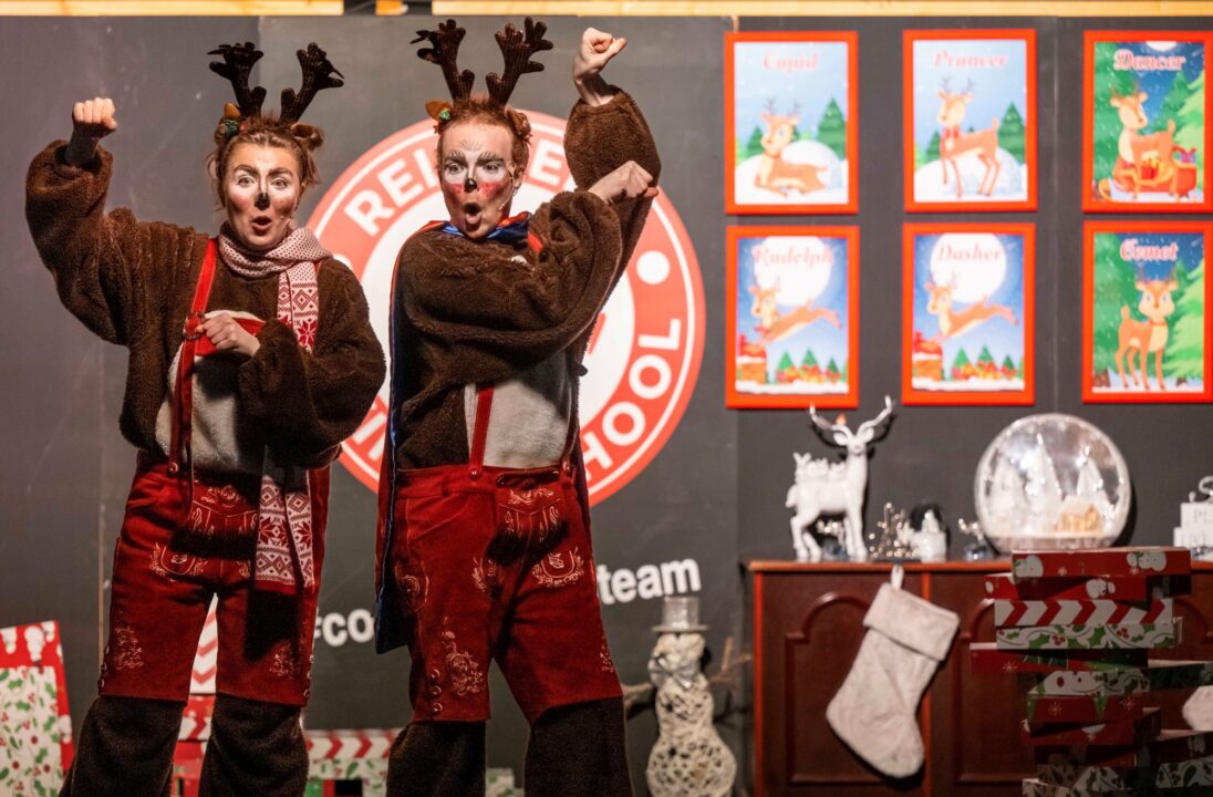 2 people dressed as reindeers.