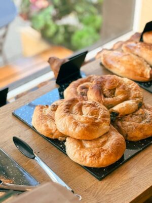 Our daily bake selection brings together flavours from home and favourites from here — warm borek, buttery croissants and handmade Botcha pasties.