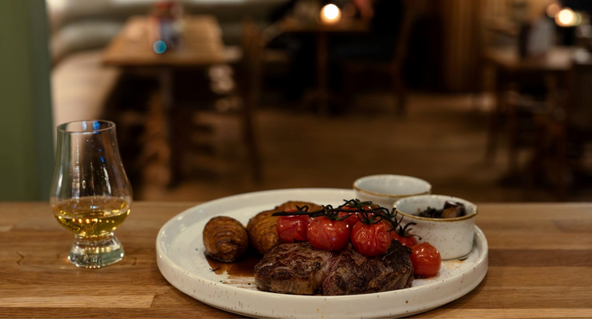 A Plate of food and a whisky at Hot Toddy.