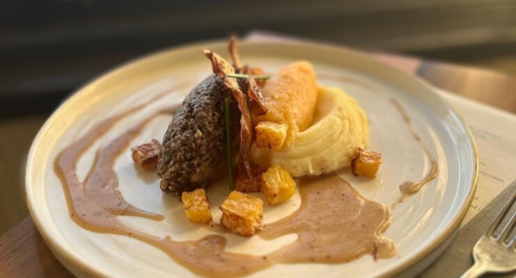 Burns supper at Canonball Restaurant with a plate with Haggis, neeps and tatties.