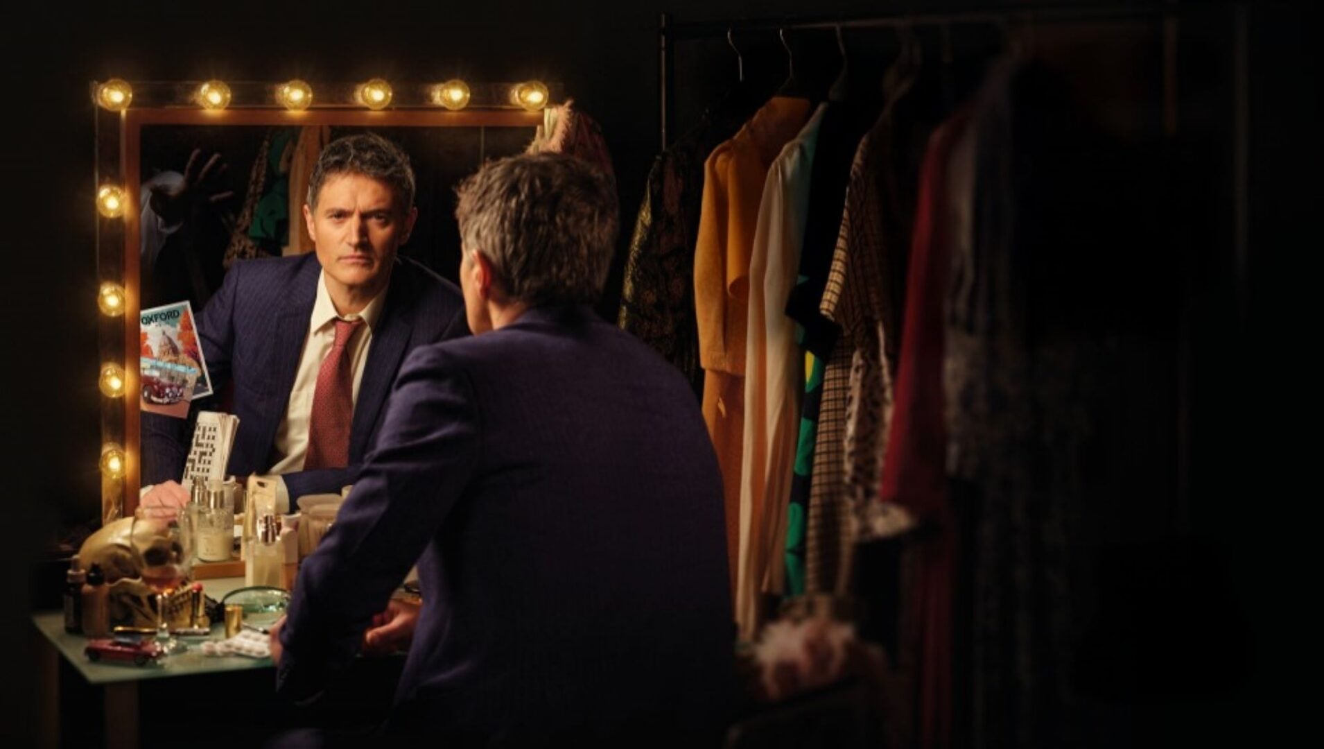 A man looking at himself in a mirror.