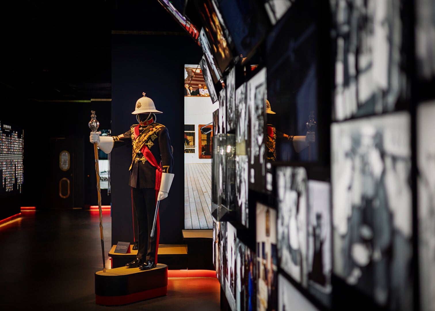 Photos and uniform on display at the visitor centre of Royal Yacht Britannia