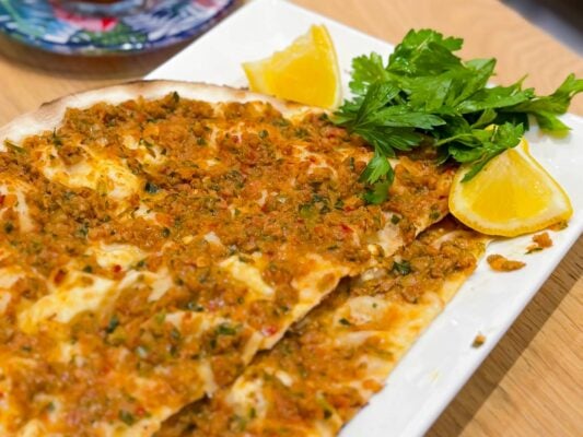 A Turkish classic — lahmacun, thin and crispy flatbread topped with spiced minced meat, fresh from the oven.