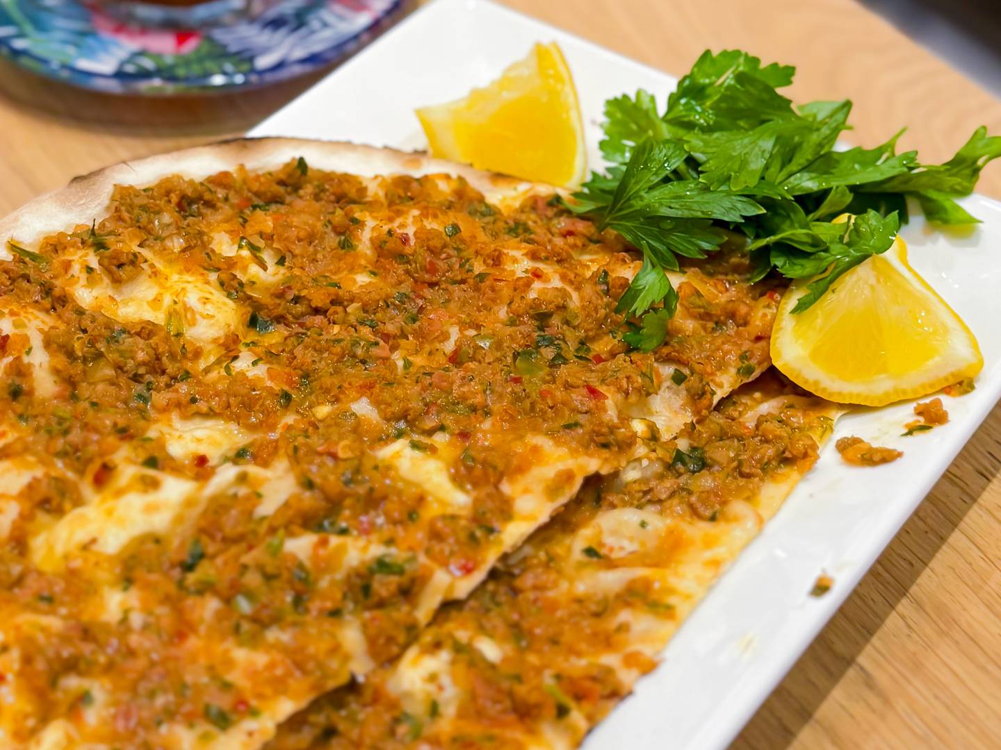A Turkish classic — lahmacun, thin and crispy flatbread topped with spiced minced meat, fresh from the oven.