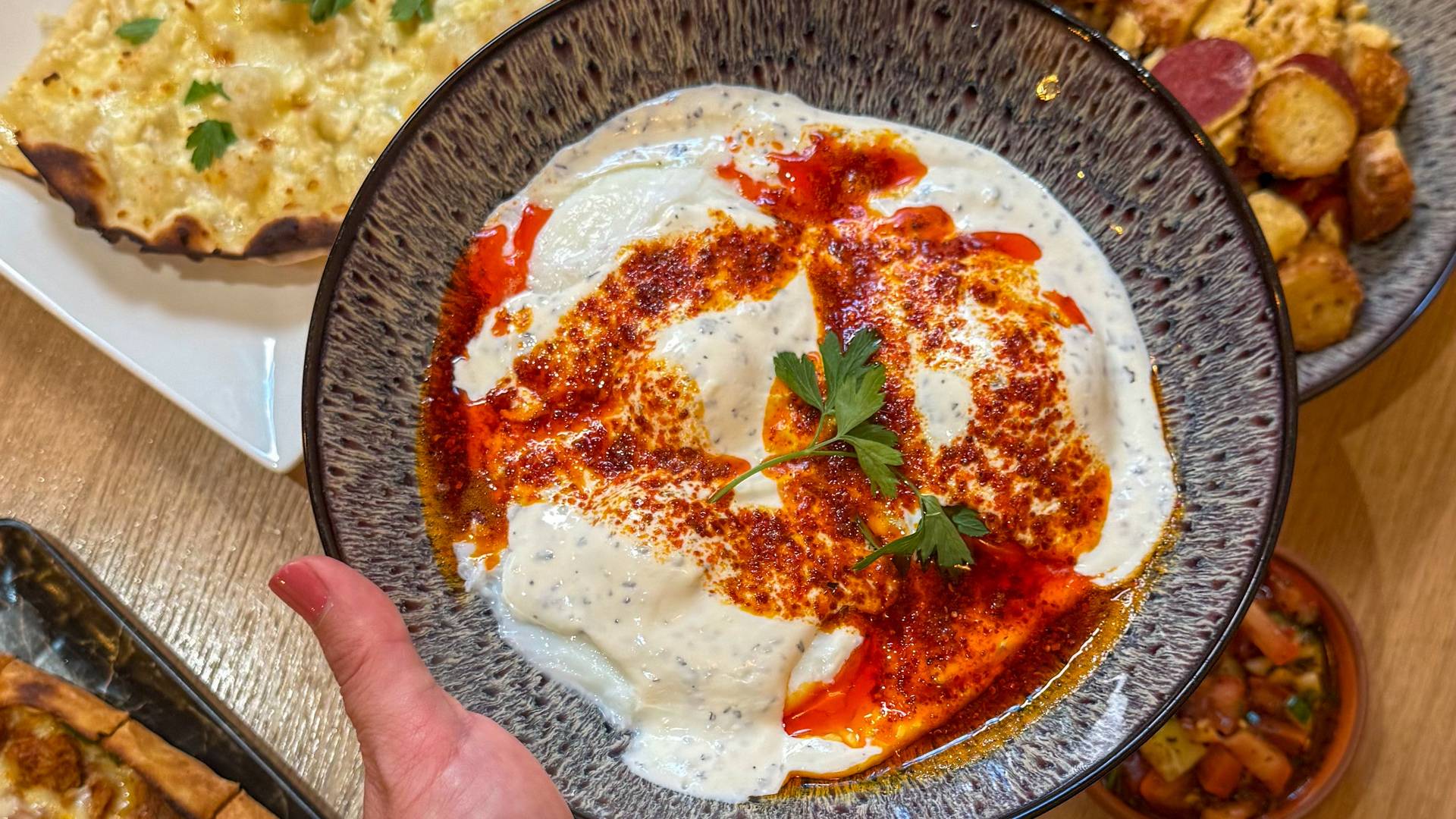 Classic Turkish eggs, served warm as part of our brunch menu.