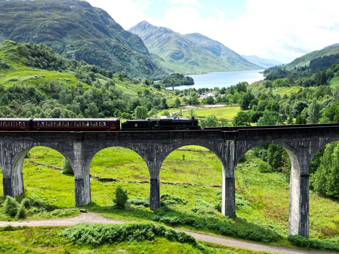 Train going bridge in Scottish Highlands