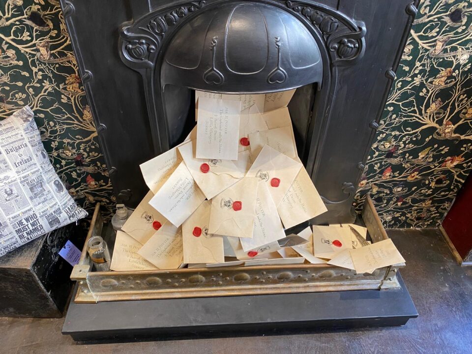 Letters pouring out of a fireplace