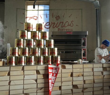 Stack of cans on counter in front of Civerinos pizza oven,© Civerinos